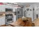 Updated kitchen features stainless appliances, and a center island. Perfect for cooking and entertaining at 710 Freeman Dr, Covington, GA 30016