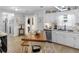 Bright kitchen features granite counters, stainless appliances, and a butcher block island with bench seating at 710 Freeman Dr, Covington, GA 30016