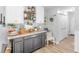 Charming kitchen with gray cabinets, white upper cabinets, and stylish decor at 710 Freeman Dr, Covington, GA 30016