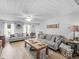 Inviting living room features comfortable seating, neutral decor, and stylish accents and wood look flooring at 710 Freeman Dr, Covington, GA 30016