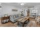 Comfortable living room features stylish decor, neutral paint, wood-look floors, and plenty of seating at 710 Freeman Dr, Covington, GA 30016