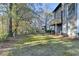 Exterior shot of backyard with deck and wooded area at 1285 Cedar Brook Dr, Lawrenceville, GA 30043