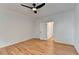 Bedroom with hardwood floors, ceiling fan, and double door closet at 1285 Cedar Brook Dr, Lawrenceville, GA 30043