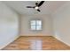 Bright bedroom featuring hardwood floors, a ceiling fan and natural light at 1285 Cedar Brook Dr, Lawrenceville, GA 30043