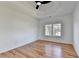 Bedroom featuring hardwood floors, neutral paint, and lots of light from a window at 1285 Cedar Brook Dr, Lawrenceville, GA 30043