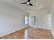 Bedroom boasts hardwood floors, tray ceiling, and views of ensuite at 1285 Cedar Brook Dr, Lawrenceville, GA 30043