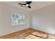 A bright, airy bedroom with a modern ceiling fan and lots of natural light from the window at 1285 Cedar Brook Dr, Lawrenceville, GA 30043
