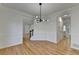 This dining room features hardwood floors, and flows into other living areas with white walls and trim at 1285 Cedar Brook Dr, Lawrenceville, GA 30043