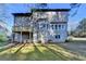 Back exterior view of the home with a deck at 1285 Cedar Brook Dr, Lawrenceville, GA 30043