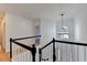 Open foyer with modern light fixture, wooden floors, and stair railing at 1285 Cedar Brook Dr, Lawrenceville, GA 30043