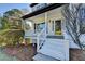 Inviting front porch with white brick, white railings, freshly painted steps, and a stylish front door at 1285 Cedar Brook Dr, Lawrenceville, GA 30043