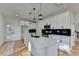 Stylish kitchen with a center island, stainless steel appliances, and access to the outdoor patio at 1285 Cedar Brook Dr, Lawrenceville, GA 30043