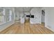 Modern kitchen featuring white cabinets, a center island, stainless steel appliances, and wood flooring at 1285 Cedar Brook Dr, Lawrenceville, GA 30043