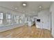 Bright, open-concept kitchen with white cabinets, quartz countertops, and large windows offering ample natural light at 1285 Cedar Brook Dr, Lawrenceville, GA 30043