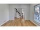 Inviting living space with hardwood floors and a clear view through to staircase in an open layout design at 1285 Cedar Brook Dr, Lawrenceville, GA 30043