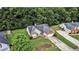 Traditional-style home with brick accents, a manicured lawn, and mature trees, offering great curb appeal at 1290 Silverstone Trl, Jonesboro, GA 30238
