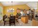 Eat-in kitchen with stainless steel appliances, granite countertops, and a functional island at 1290 Silverstone Trl, Jonesboro, GA 30238