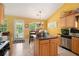 Bright kitchen with granite countertops, stainless steel appliances, and an island prep station at 1290 Silverstone Trl, Jonesboro, GA 30238