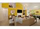 Cozy living room with fireplace, bright yellow walls, built-in shelving and comfortable seating at 1290 Silverstone Trl, Jonesboro, GA 30238