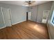 Bright bedroom with wood floors and natural light, this spacious room features multiple closets for extra storage at 2715 Cordite Loop, Snellville, GA 30039