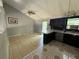 Open kitchen and dining area featuring a breakfast bar, black cabinetry, and access to an outdoor deck at 2715 Cordite Loop, Snellville, GA 30039