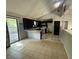 Open kitchen and dining area featuring a breakfast bar, tile floors, and access to an outdoor deck at 2715 Cordite Loop, Snellville, GA 30039