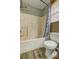 Bathroom featuring a tub and a toilet at 4090 Mark Todd Ct, Hoschton, GA 30548