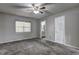 Bedroom features new carpeting, a ceiling fan, and an ensuite bathroom at 4090 Mark Todd Ct, Hoschton, GA 30548