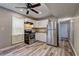 The spacious kitchen features stainless steel appliances, wood look floors, and ample cabinet space at 4090 Mark Todd Ct, Hoschton, GA 30548