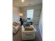 Cozy home office furnished with comfortable seating, a desk, and natural light at 4261 Notting Hill Sw Dr, Atlanta, GA 30331