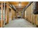 Unfinished basement with exposed pipes and lumber at 7434 Chads Cir, Jonesboro, GA 30236