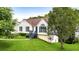 Charming exterior view of a well-maintained home with a lush green lawn and mature trees at 7434 Chads Cir, Jonesboro, GA 30236