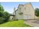 Two-story home featuring vinyl siding, a two-car garage, and a well-kept lawn in a suburban setting at 7434 Chads Cir, Jonesboro, GA 30236