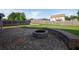 Large backyard with a brick-paved patio, fire pit, and a well-maintained lawn, perfect for outdoor activities and relaxation at 9120 Alden Dr, Locust Grove, GA 30248