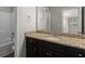 Bathroom featuring granite counters, dark cabinetry, and tub and shower combo at 9120 Alden Dr, Locust Grove, GA 30248