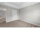 This bedroom has neutral paint, carpeted floor, and a modern ceiling at 9120 Alden Dr, Locust Grove, GA 30248