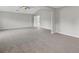 A bright and airy bedroom featuring plush carpeting and a ceiling fan for added comfort at 9120 Alden Dr, Locust Grove, GA 30248