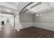 Elegant dining room featuring stylish wainscoting, tray ceilings, and modern chandelier at 9120 Alden Dr, Locust Grove, GA 30248