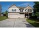 Charming home with a two-car garage, well-maintained lawn, and inviting curb appeal at 9120 Alden Dr, Locust Grove, GA 30248