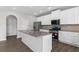Beautiful island kitchen with granite counters, stainless steel appliances, and white cabinetry at 9120 Alden Dr, Locust Grove, GA 30248