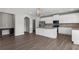 Bright kitchen with white cabinets, stainless appliances, granite countertops and an island at 9120 Alden Dr, Locust Grove, GA 30248