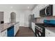Well-equipped kitchen with granite countertops, white cabinets and stainless steel appliances at 9120 Alden Dr, Locust Grove, GA 30248