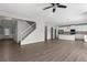 Open floor plan featuring gray walls, wood floors, white trim, and a staircase at 9120 Alden Dr, Locust Grove, GA 30248
