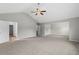 Large bedroom with carpeting, ceiling fan, vaulted ceiling, and access to a closet at 9120 Alden Dr, Locust Grove, GA 30248