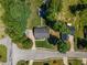 Overhead shot of home and neighborhood showcasing mature trees, well kept lawns at 100 Chadwick Pl, Villa Rica, GA 30180