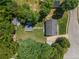 Bird's eye view of house, pool, yard, and neighborhood featuring mature trees and landscaping at 100 Chadwick Pl, Villa Rica, GA 30180