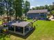 Large home backyard with patio, picnic area, and treed space at 100 Chadwick Pl, Villa Rica, GA 30180