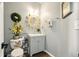 Charming half-bathroom with stylish decor and vintage-inspired accents at 100 Chadwick Pl, Villa Rica, GA 30180
