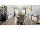 Elegant dining room with chandelier, modern decor, and plenty of seating at 100 Chadwick Pl, Villa Rica, GA 30180