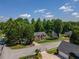 Traditional two-story brick home with well-manicured lawn, mature trees, and a welcoming curb appeal at 100 Chadwick Pl, Villa Rica, GA 30180